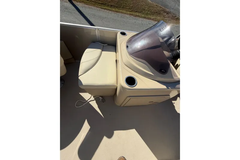 Slide: The Image of 2018 Sylvan Mirage Fish 8520 4-PT boat interior with beige seating and console. - 16