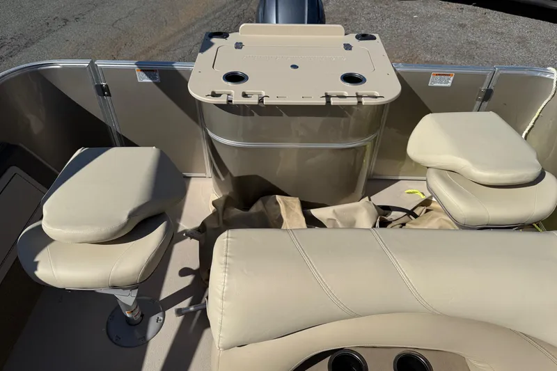 Slide: The Image of 2018 Sylvan Mirage Fish 8520 4-PT boat interior with beige seating and fishing station. - 23