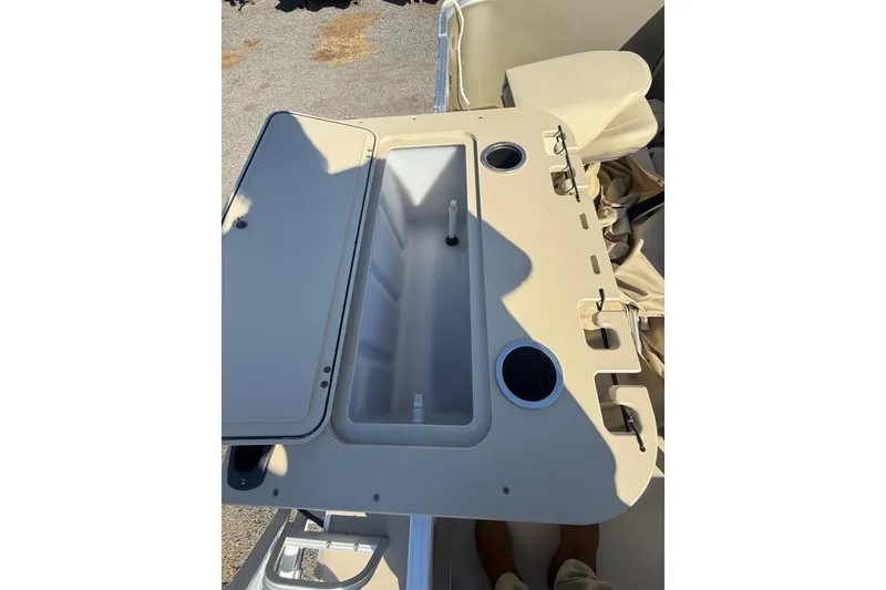 Slide: The Image of 2018 Sylvan Mirage Fish 8520 4-PT boat console with cup holders and storage compartment. - 25