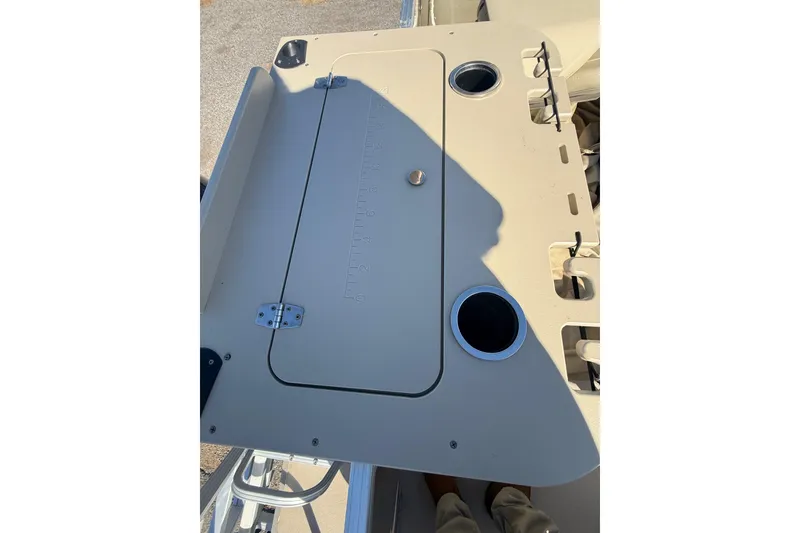 Slide: The Image of 2018 Sylvan Mirage Fish 8520 4-PT boat deck with storage compartment and cup holders. - 26