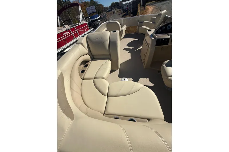 Slide: The Image of 2018 Sylvan Mirage Fish 8520 4-PT boat with beige seating and spacious interior. - 27