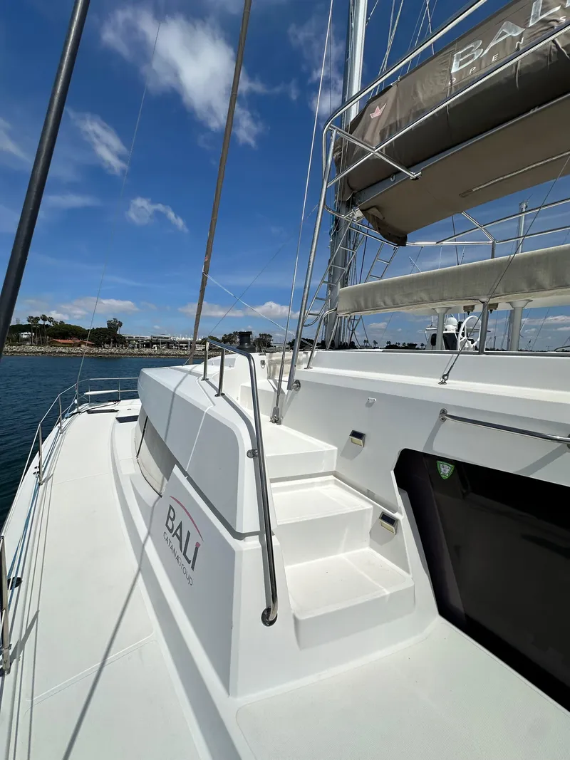 Slide: The Image of 2021 Bali 4.8 yacht deck with clear blue sky and marina view. - 11