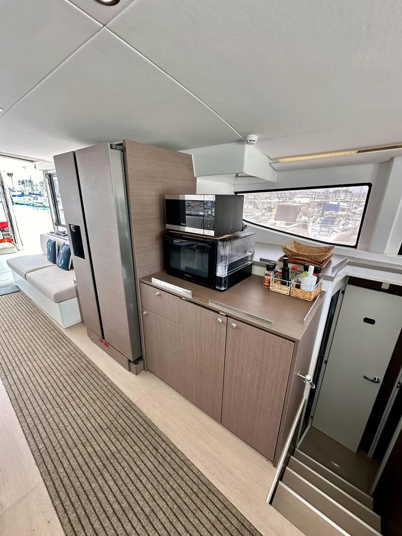 Slide: The Image of Modern interior of 2021 Bali 4.8 yacht with kitchen and seating area. - 36