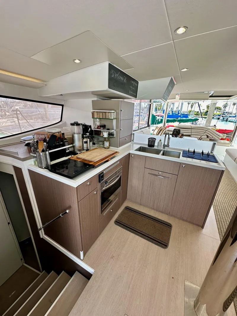 Slide: The Image of Modern kitchen interior on a 2021 Bali 4.8 yacht, featuring sleek cabinetry and appliances. - 37