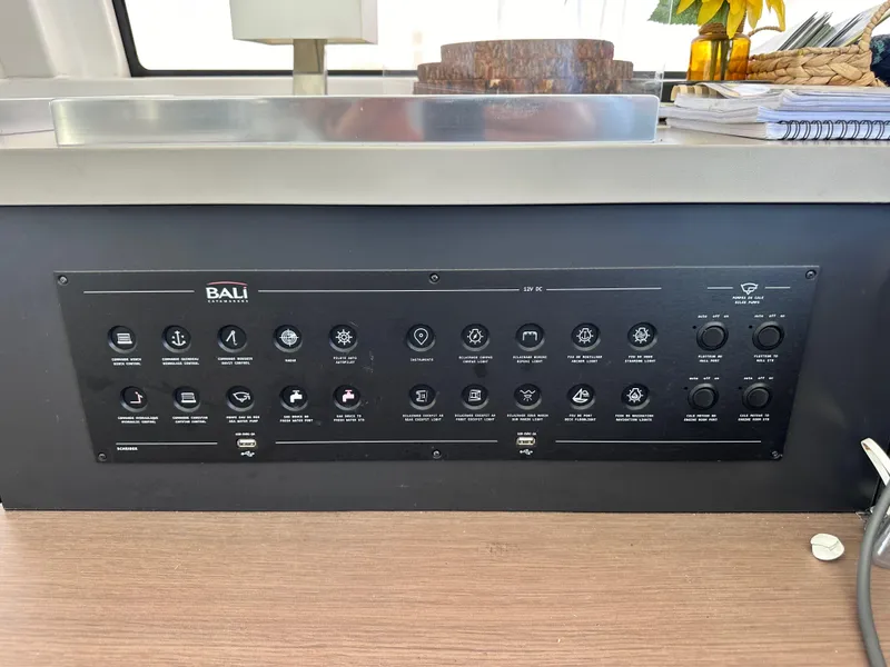 Slide: The Image of Control panel of a 2021 Bali 4.8 yacht with various switches and indicators. - 40