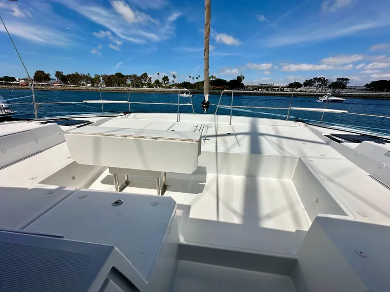 Slide: The Image of Bali 4.8 catamaran deck, 2021 model, with ocean view and clear blue sky. - 42