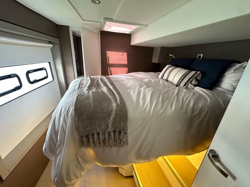 Slide: The Image of Cozy bedroom in 2021 Bali 4.8 yacht with modern decor and natural light. - 46