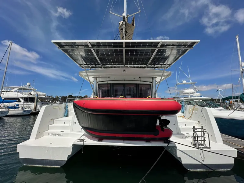 Slide: The Image of 2021 Bali 4.8 catamaran with solar panels docked at marina. - 8