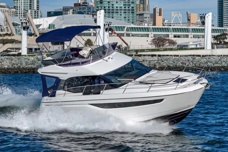 Slide: The Image of 2024 Bavaria R40 yacht cruising near urban waterfront. - 1