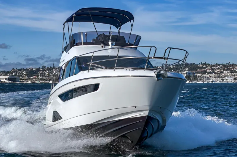 Slide: The Image of 2024 Bavaria R40 yacht cruising on open water, showcasing sleek design and powerful performance. - 11