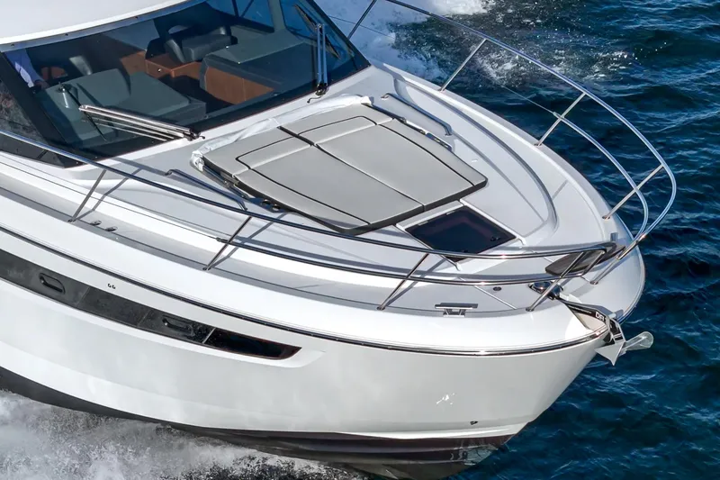 Slide: The Image of 2024 Bavaria R40 yacht cruising on open water, showcasing sleek design and modern features. - 18