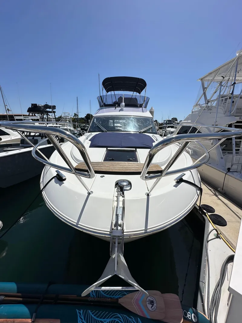 Slide: The Image of 2024 Bavaria R40 yacht docked at marina under clear blue sky. - 32