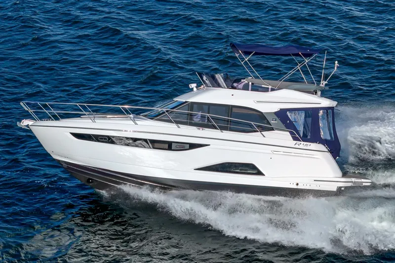 Slide: The Image of 2024 Bavaria R40 yacht cruising on open water, showcasing sleek design and luxury features. - 4