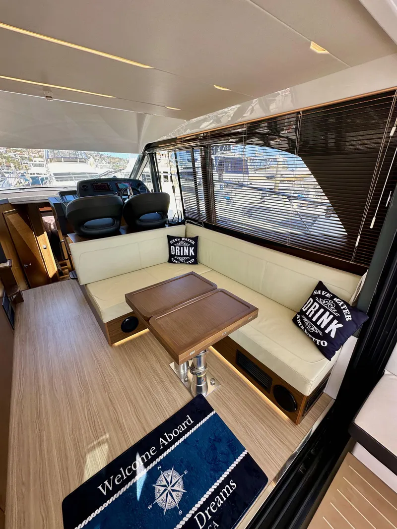 Slide: The Image of Luxurious interior of 2024 Bavaria R40 yacht with elegant seating and nautical decor. - 46