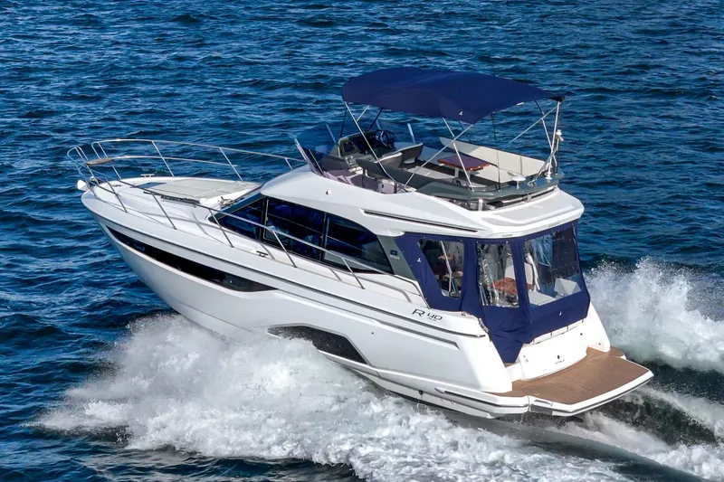 Slide: The Image of 2024 Bavaria R40 yacht cruising on open water, showcasing sleek design and luxury features. - 8