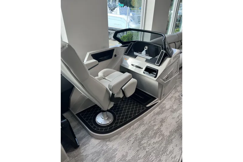 Slide: The Image of 2026 Starcraft RX 25 DL DC boat interior with modern helm and comfortable seating. - 6