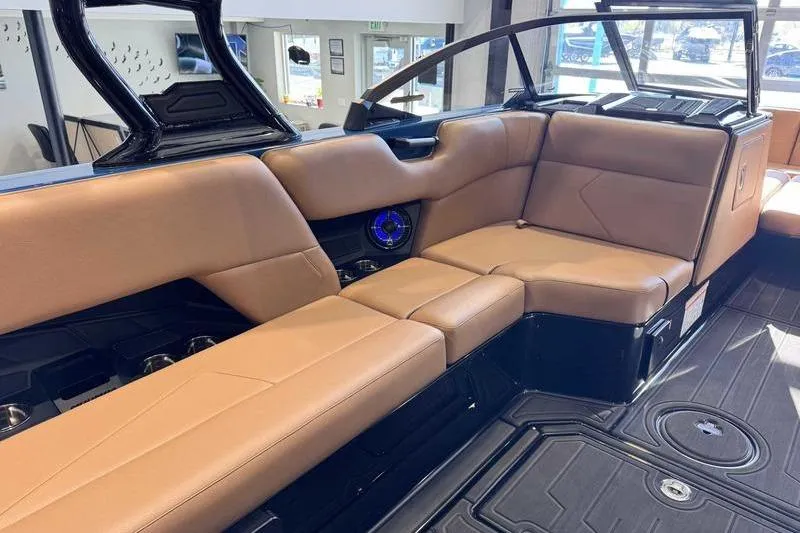 Slide: The Image of Luxurious interior of 2026 Moomba Tykon boat with tan leather seating. - 11