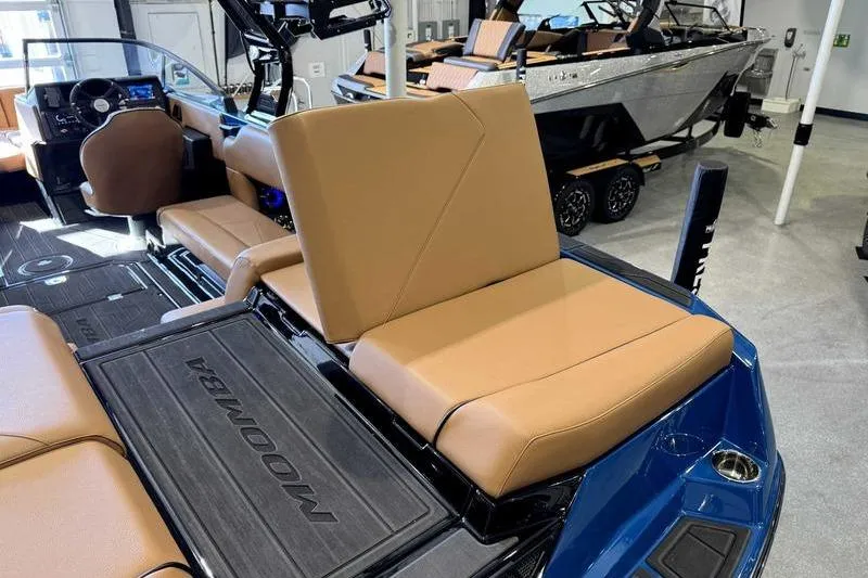 Slide: The Image of 2026 Moomba Tykon boat interior with tan seats and modern dashboard. - 14