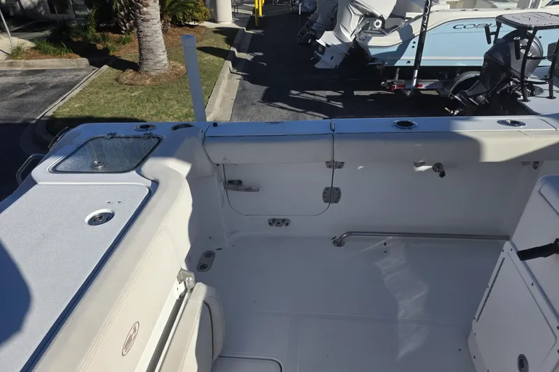 Slide: The Image of 2020 Sea Hunt Gamefish 30 boat interior with forward seating and storage compartments. - 11