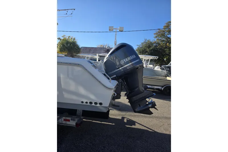 Slide: The Image of 2020 Sea Hunt Gamefish 30 with Yamaha outboard motor in a sunny outdoor setting. - 13