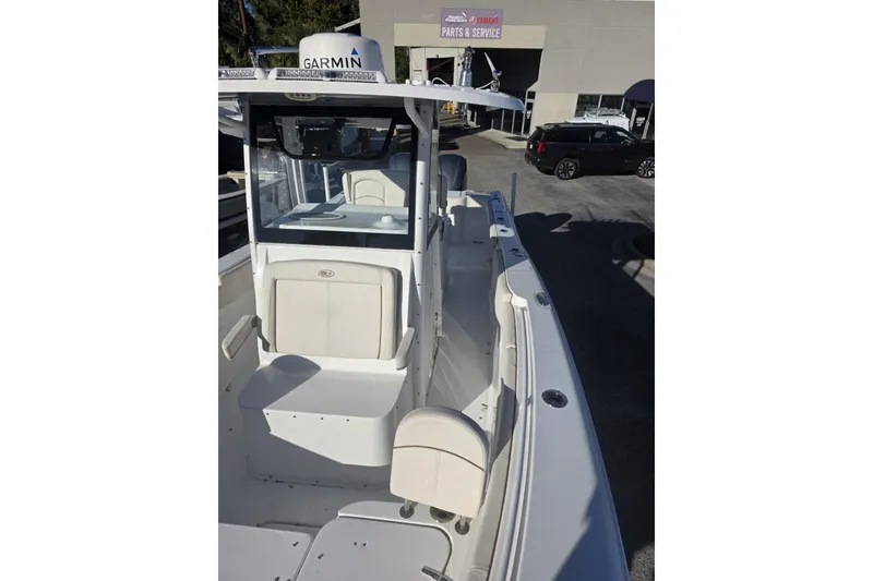 Slide: The Image of 2020 Sea Hunt Gamefish 30 Forward Seating boat with Garmin equipment, parked at a service center. - 6