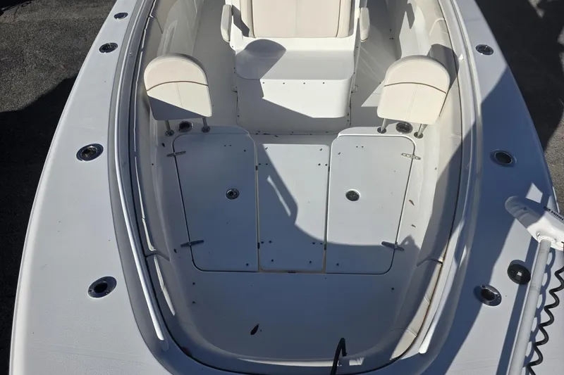 Slide: The Image of 2020 Sea Hunt Gamefish 30 Forward Seating boat interior with white cushioned seats. - 7