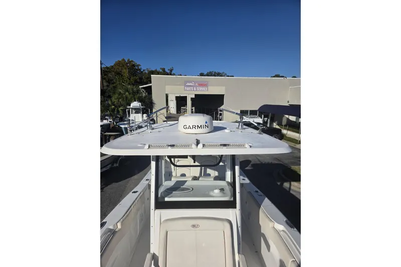 Slide: The Image of 2020 Sea Hunt Gamefish 30 boat with Garmin equipment at a service center. - 8