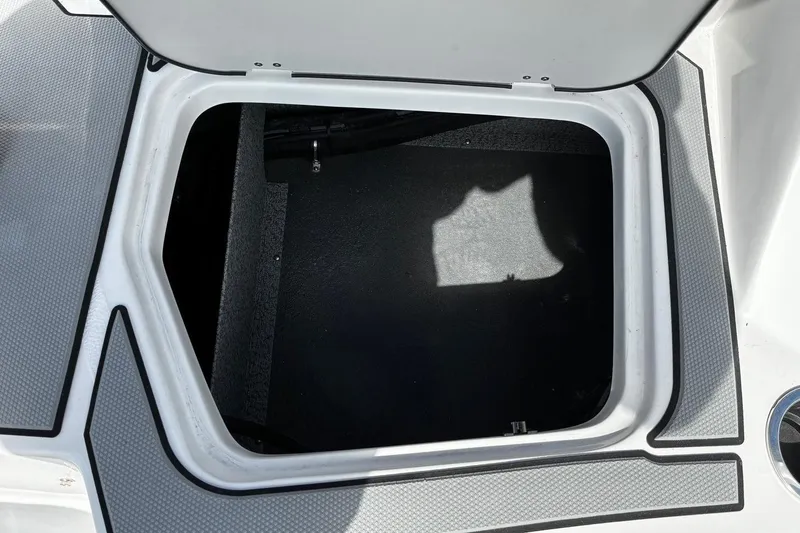 Slide: The Image of Open storage compartment on 2026 Starcraft SV 16 OB boat. - 8