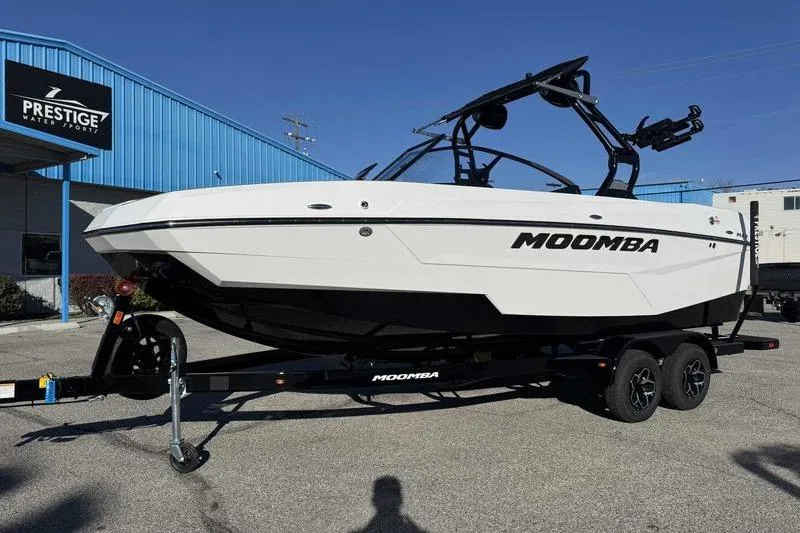 The Image of 2026 Moomba Tykon boat on trailer at Prestige Water Sports dealership. - 1