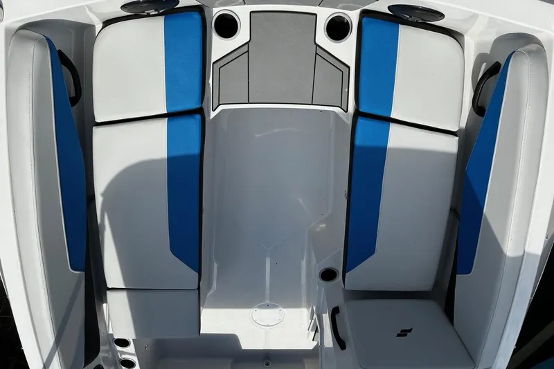 Slide: The Image of 2026 Starcraft SV 16 OB boat interior with blue and white seating. - 16