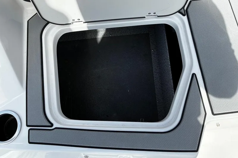 Slide: The Image of Open storage compartment on 2026 Starcraft SV 16 OB boat deck. - 7