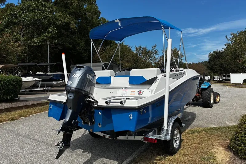 Slide: The Image of 2026 Starcraft SV 16 OB boat with Yamaha motor on a trailer, parked outdoors. - 3