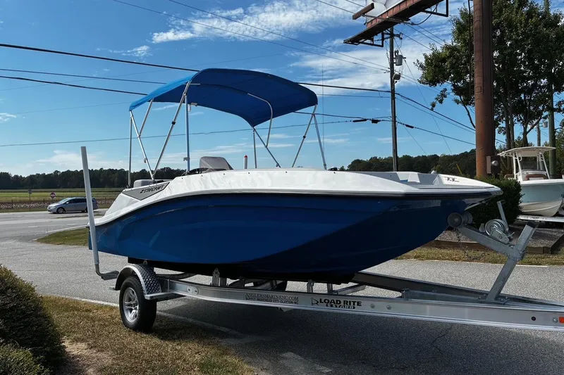Slide: The Image of 2026 Starcraft SV 16 OB boat with blue hull and canopy on a trailer. - 4