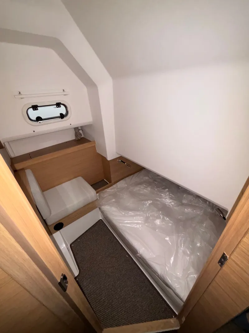 Slide: The Image of Compact cabin interior of 2026 Nimbus Commuter 11 MKII Legacy Edition boat. - 18