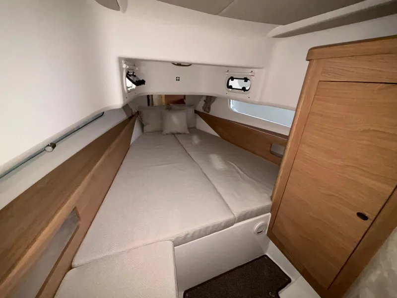 Slide: The Image of Cozy cabin interior of 2026 Nimbus Commuter 11 MKII Legacy Edition boat. - 20