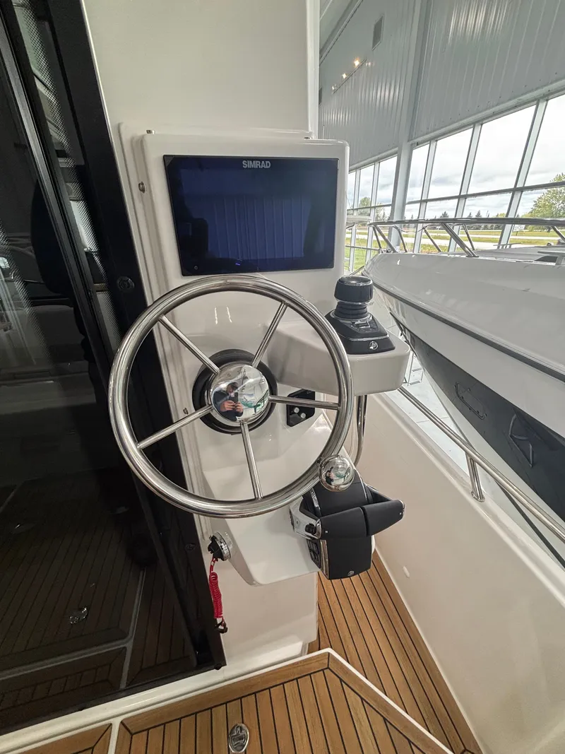 Slide: The Image of Steering wheel and controls of Nimbus Commuter 11 MKII Legacy Edition, 2026 model. - 6