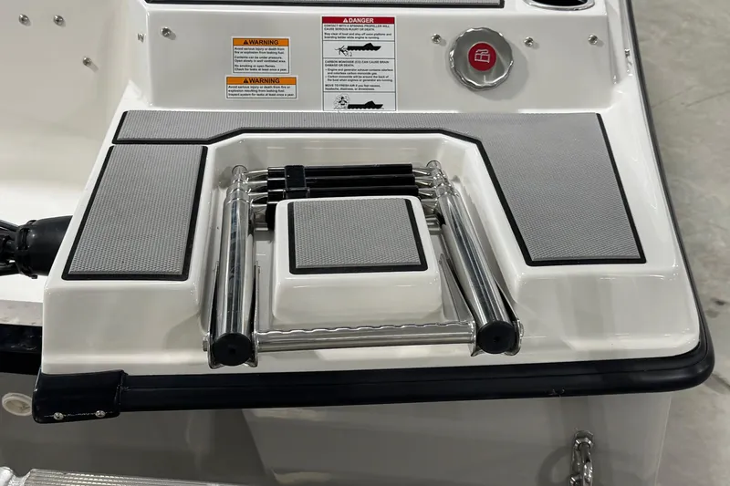 Slide: The Image of 2026 Starcraft SV 16 OB boat ladder and deck with safety warnings. - 20