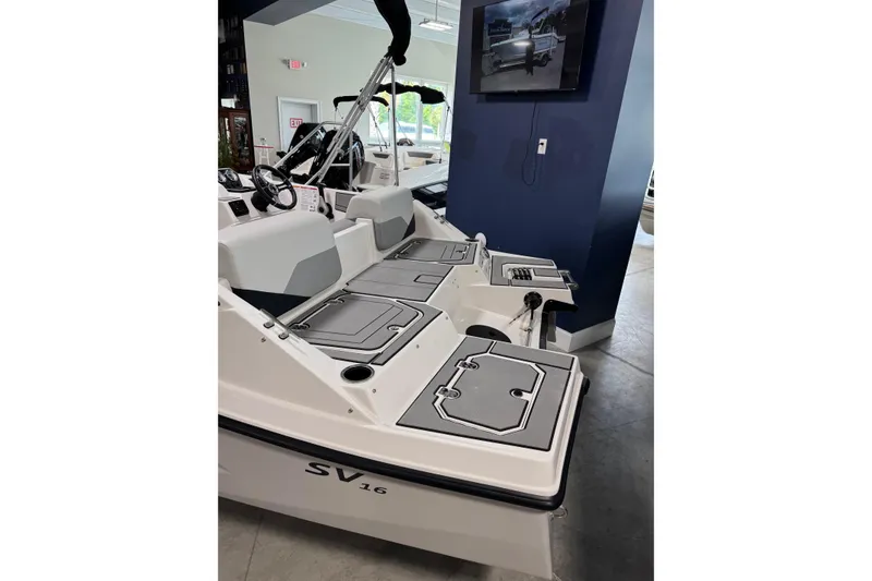 Slide: The Image of 2026 Starcraft SV 16 OB boat interior with seating and storage compartments. - 6