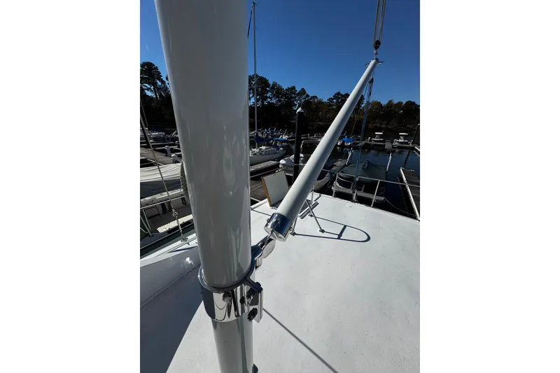 Slide: The Image of 1982 Marine Trader Europa boat docked with yellow rope and cleat. - 19