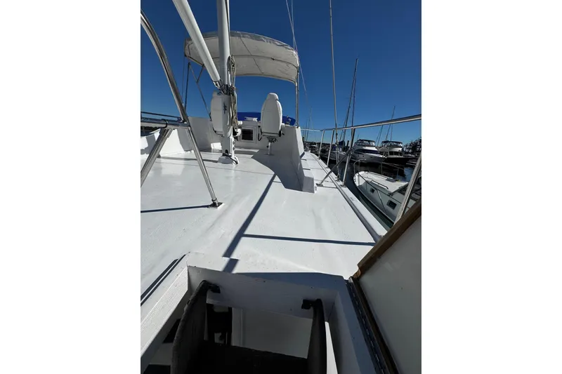 Slide: The Image of 1982 Marine Trader Europa boat deck with Lewmar equipment under bright sun. - 20