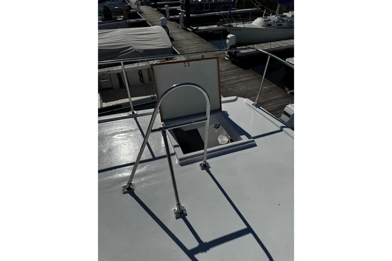 Slide: The Image of 1982 Marine Trader Europa boat deck with two white captain chairs. - 24