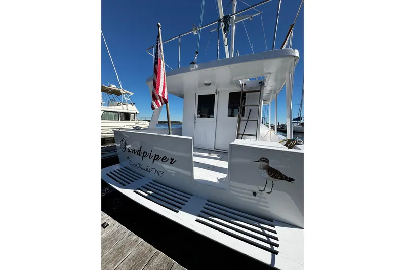 Slide: The Image of 1982 Marine Trader Europa boat deck with open hatch and railing - 28