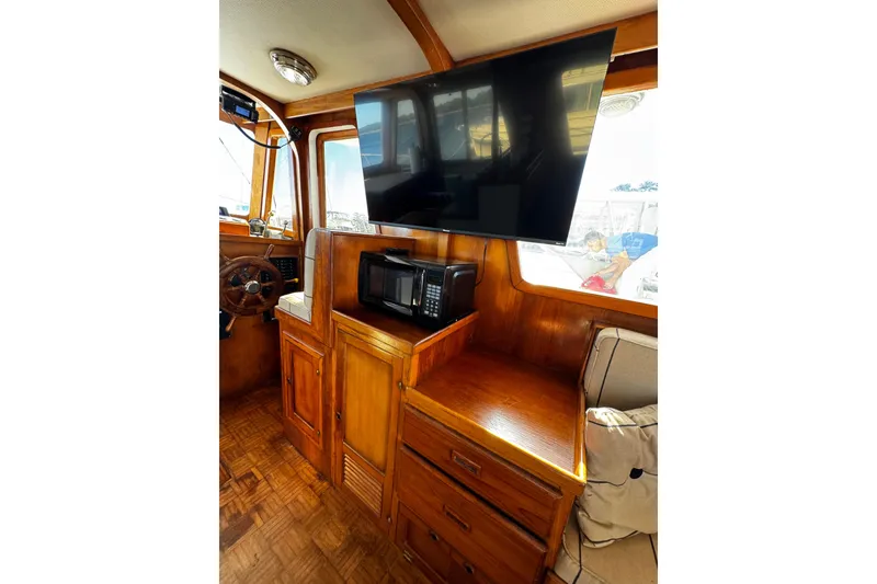 Slide: The Image of 1982 Marine Trader Europa yacht docked at marina, side view. - 36