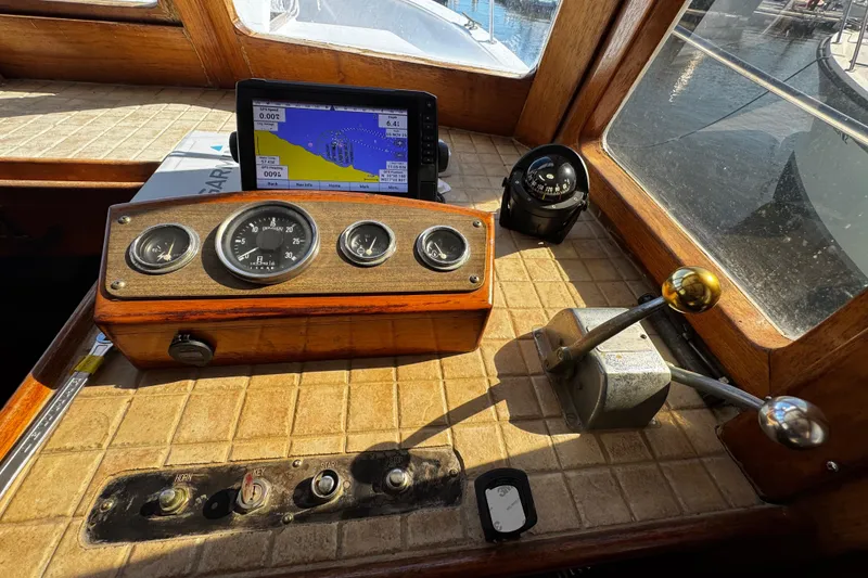 Slide: The Image of Interior of 1982 Marine Trader Europa yacht with wood finish and modern amenities. - 42