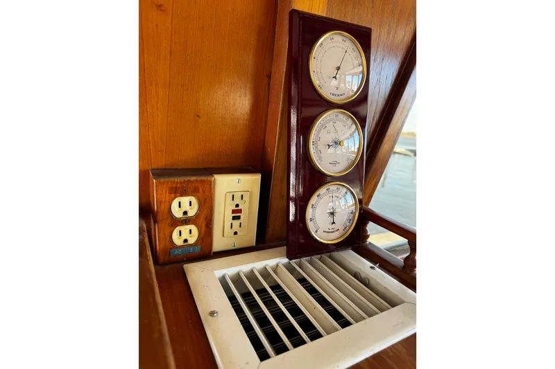 Slide: The Image of 1982 Marine Trader Europa dashboard with navigation system and gauges. - 50