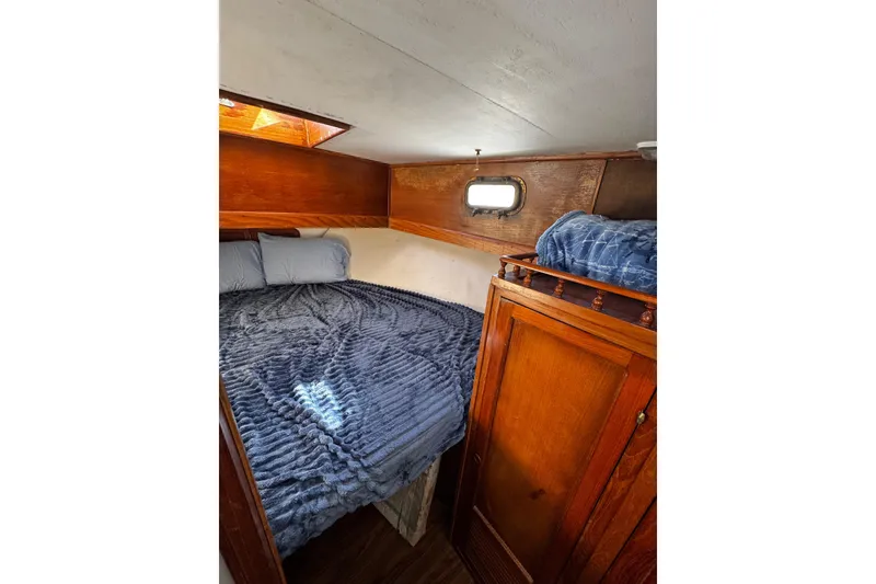 Slide: The Image of Kitchen sink with modern faucet on 1982 Marine Trader Europa yacht. - 62