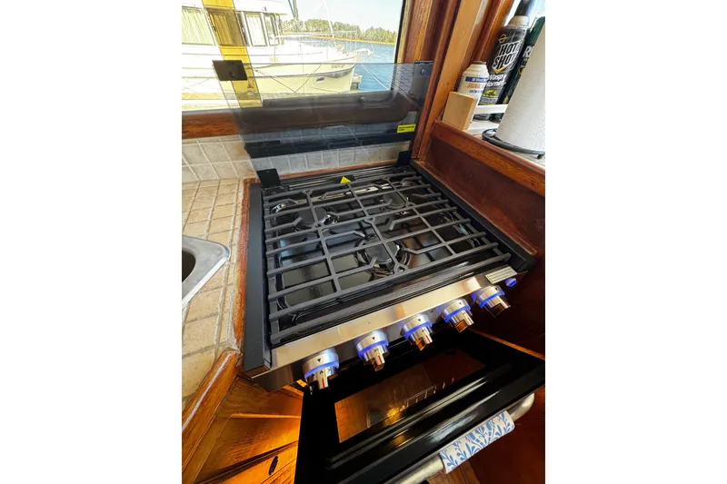 Slide: The Image of interior of new Camplux gas 3 burner stove - 68