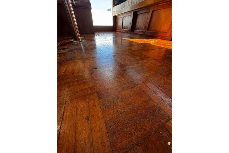 Slide: The Image of 1982 Marine Trader Europa interior with polished wooden parquet flooring - 80