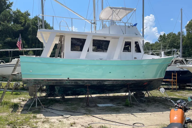 Slide: The Image of 1982 Marine Trader Europa boat with Sandpiper graphic. - 9