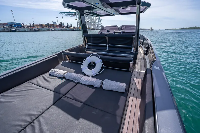 Slide: The Image of Wally 43 yacht, 2012 model, with spacious deck and seating, cruising on calm waters. - 10